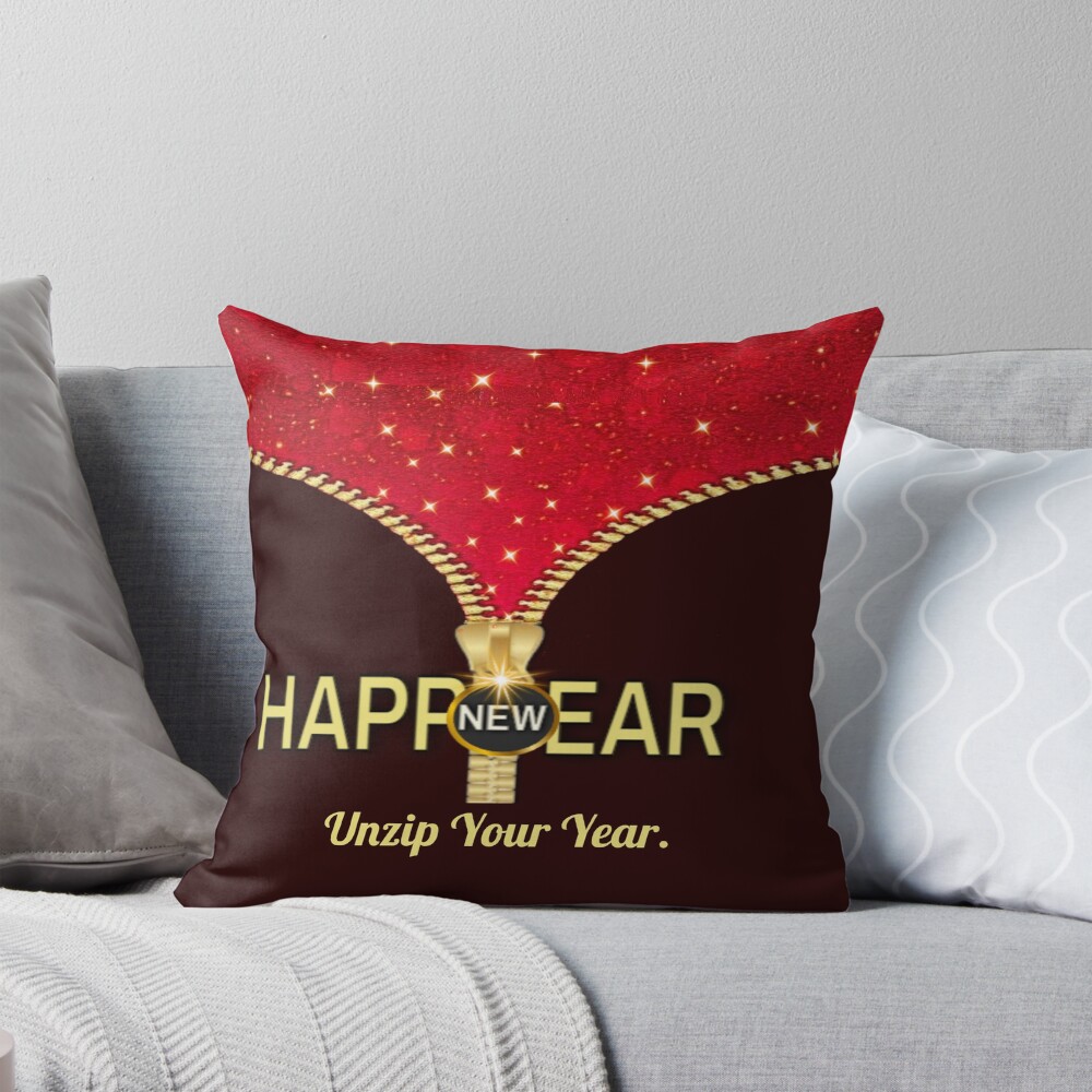Unzip Your Year conceptual design pillow with golden zipper opening into New Year text on red background